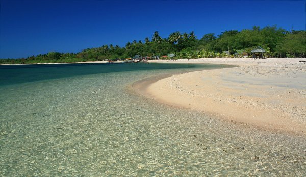 the curving beach in front of Armada Resort, Magalawa Island