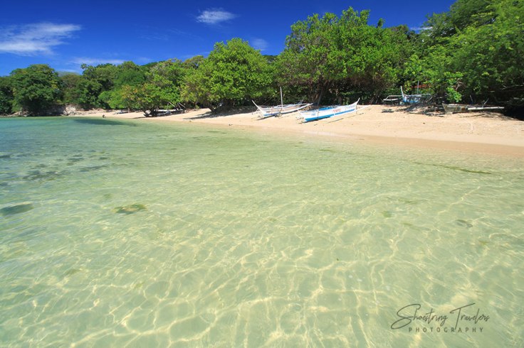 crystal-clear waters at the northern half of Manuel Uy Beach
