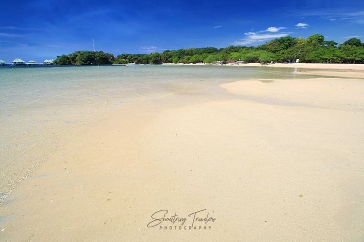 Manuel Uy Beach's creamy beige sand